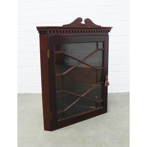 455 - Mahogany corner cupboard, swan neck top with dentil frieze above a glazed door with a shelved interi... 