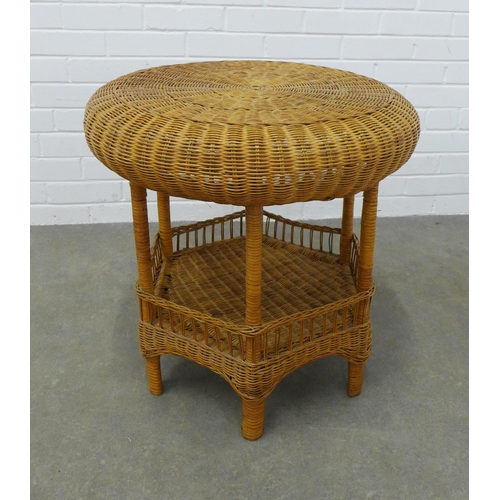 457 - A vintage wicker table, circular with an undertier, 61 x 62cm.