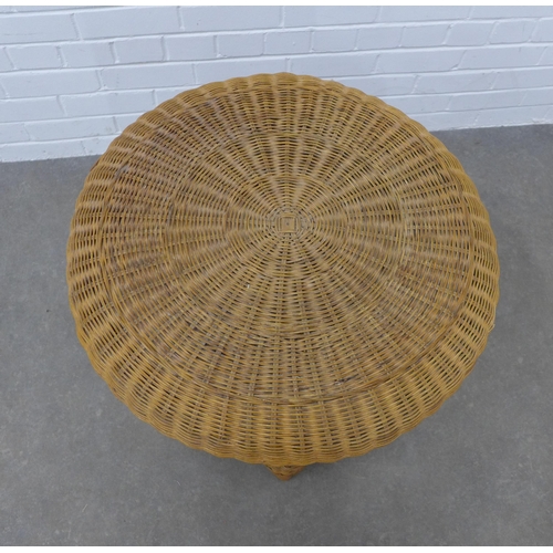 457 - A vintage wicker table, circular with an undertier, 61 x 62cm.