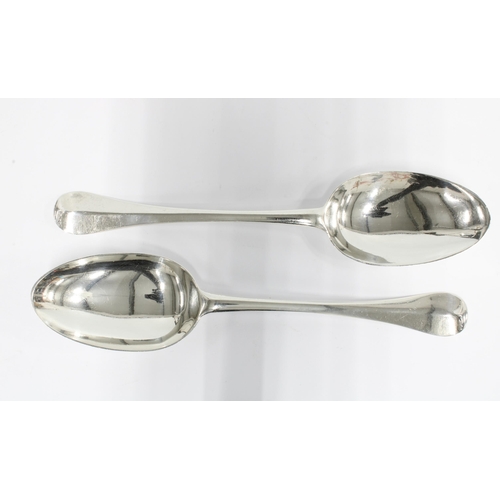54 - A pair of late 17th / early 18th century silver Hanoverian rat tail table spoons, 20cm long (2)