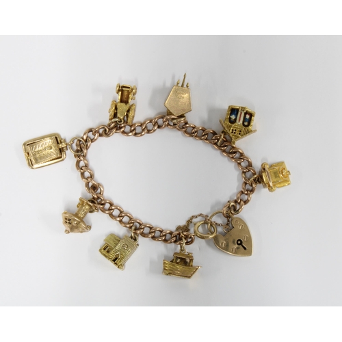 65 - 9ct gold charm bracelet with a heart shaped pendant, with eight charms - six stamped 9ct