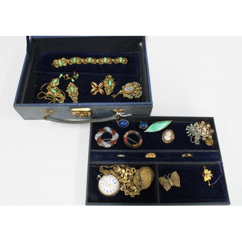 76A - A blue leather jewellery box containing an 18ct coral ring (one stone lacking), two yellow metal gem... 