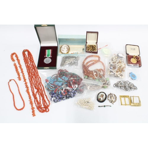 79A - Quantity of vintage costume jewellery contained within a brown leather suitcase to include coral bea... 