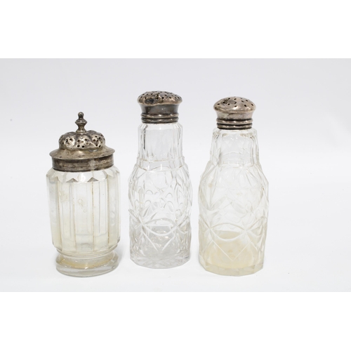 9 - Silver topped glass jar and two with white metal pierced tops, tallest 13cm together with two Georgi... 