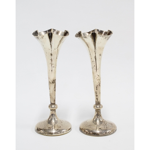 10 - A pair of late Victorian silver vases, William Hutton & Sons, London 1900, weighted bases, 14cm high... 