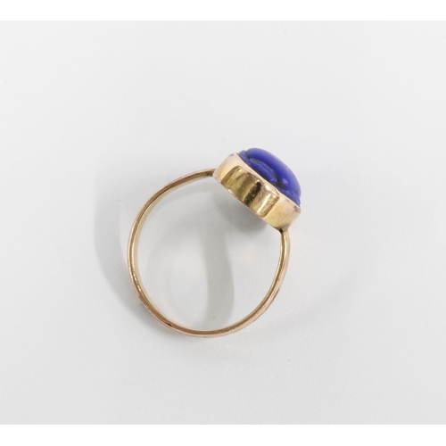 16 - An early 20th century blue scarab plaque ring,the yellow metal band with an indistinct hallmark, pos... 