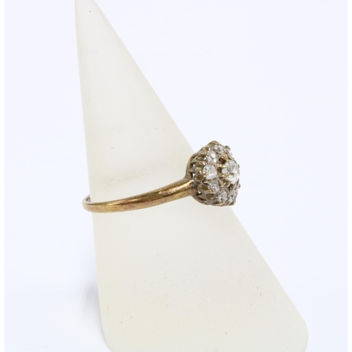 24 - Early 20th century diamond flowerhead ring, set in yellow metal, indistinct marks to the inner band