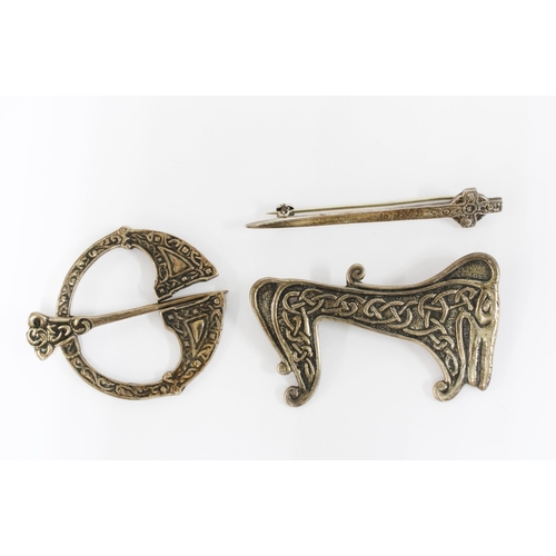 27 - An unusual lain MacCormack Iona silver brooch of mythical beast form with celtic art knotwork patter... 