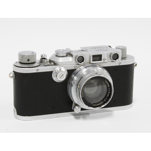 425 - A Leica 'A' 35mm Rangefinder camera, with f.5cm lens and leather case; a Leitz f=2.8m 1:6:3; light m... 