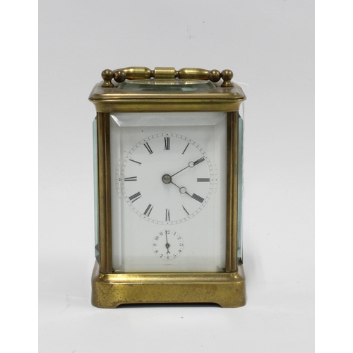 433 - Brass cased carriage clock, striking on a bell, 17cm high, including handle