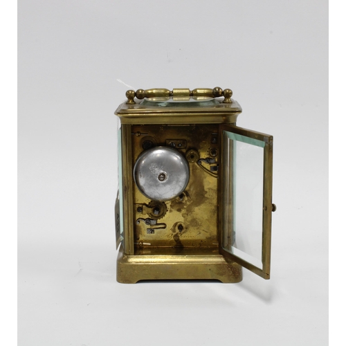 433 - Brass cased carriage clock, striking on a bell, 17cm high, including handle