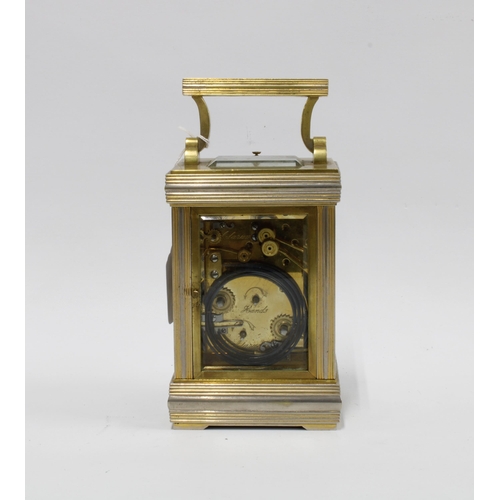 434 - Brass cased alarm carriage clock, striking on double gongs, 20cm high, including handle