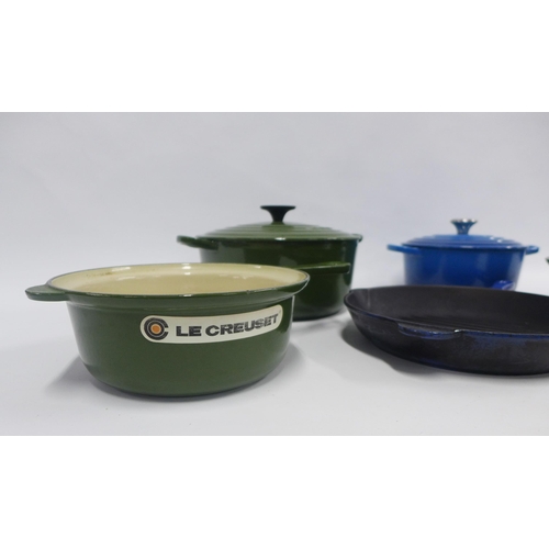 444 - Le Creuset pots and pans in blue and green, 33cm.