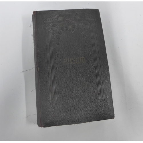 458 - Early 20th century postcard album containing a quantity of postcards