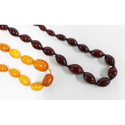 58 - A strand of graduating cherry amber beads, together with a graduating strand of butterscotch amber b... 