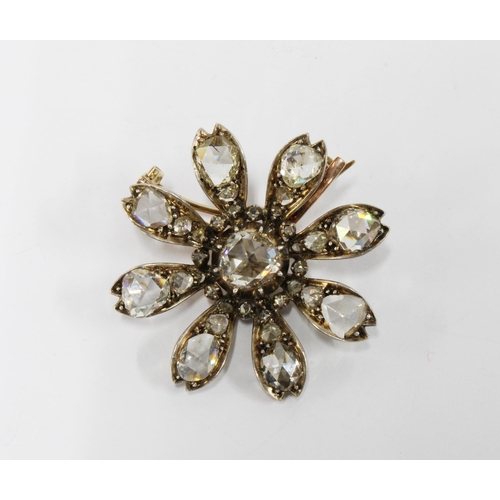 64 - Late 19th / early 20th century diamond flower head brooch, set in unmarked gold and white metal, the...
