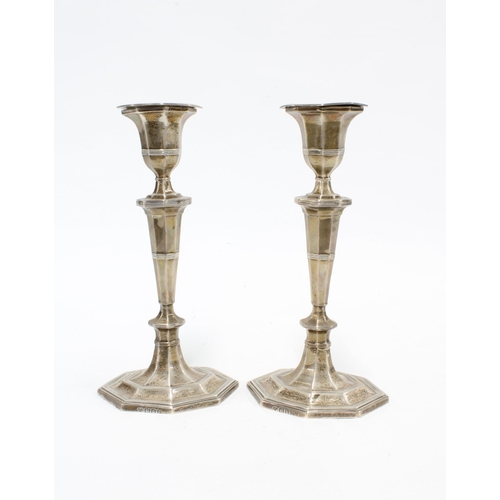 77 - Pair of Edwardian silver candlesticks, Goldsmiths and @Silversmiths Company, London 1904, 19cm high ... 