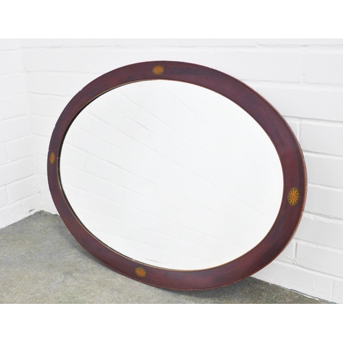 466 - A mahogany framed wall mirror with oval glass plate, 60 x 85cm