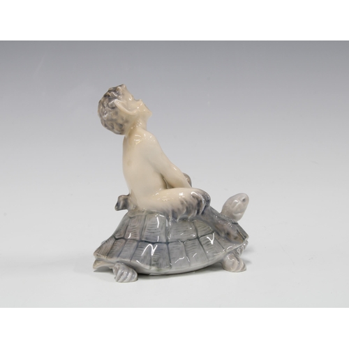 104 - Royal Copenhagen figure 'Faun on Tortoise' no. 858 designed by Christian Thomsen, 9cm.