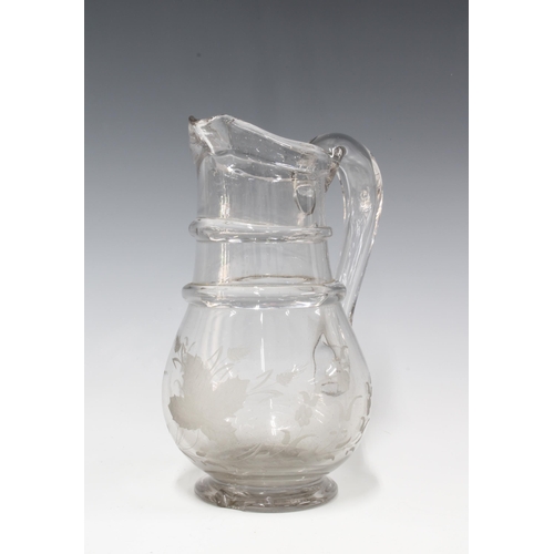 116 - An antique French glass water / ale jug with double ring neck and engraved wheatsheaf pattern, small... 