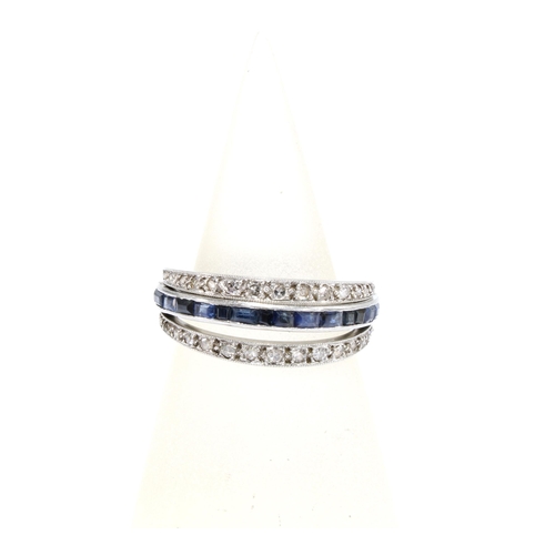 15 - An Art Deco white metal 'Day & Night' hinged full eternity ring, with  a central band half set with ... 