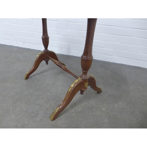 203 - Brass mounted mahogany table with an oval red hardstone top with brass gallery,  75 x 56 x 47cm.