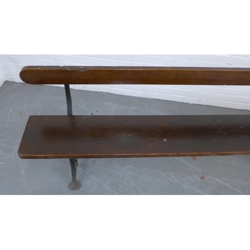 222 - Early 20th century stained pine pew / bench with black iron supports, 330 x 73 x 28cm