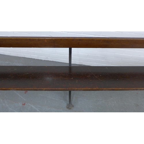 222 - Early 20th century stained pine pew / bench with black iron supports, 330 x 73 x 28cm