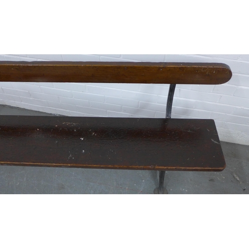 222 - Early 20th century stained pine pew / bench with black iron supports, 330 x 73 x 28cm