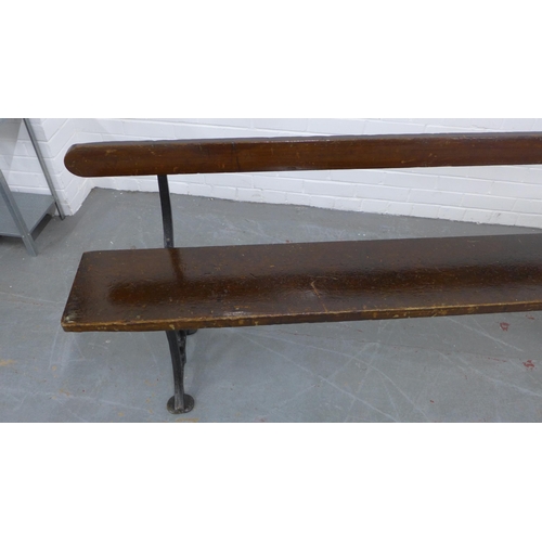 223 - Early 20th century stained pine pew / bench with black iron supports, 330 x 73 x 28cm