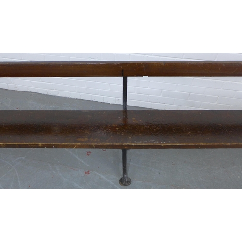 223 - Early 20th century stained pine pew / bench with black iron supports, 330 x 73 x 28cm