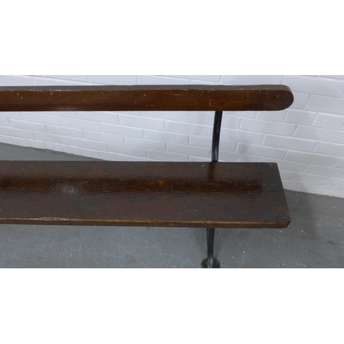 223 - Early 20th century stained pine pew / bench with black iron supports, 330 x 73 x 28cm