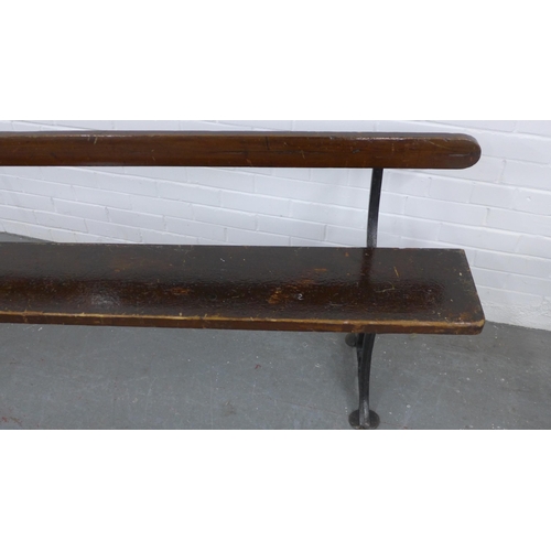 224 - Early 20th century stained pine pew / bench with black iron supports, 330 x 73 x 28cm