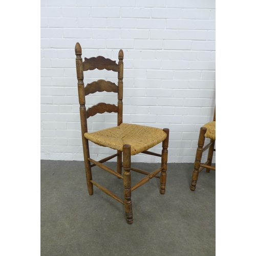 238 - Pair of ladderback kitchen chairs, woven rush seats, 43 x 97 x 43cm. (2)