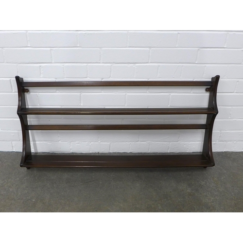 240 - An Ercol dark elm wall plate rack, 97 x 50cm.