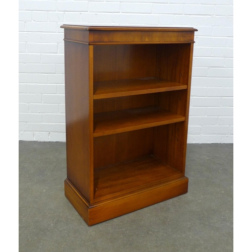 242 - A yew wood open bookcase on a plinth base, 60 x 92 x 32cm.