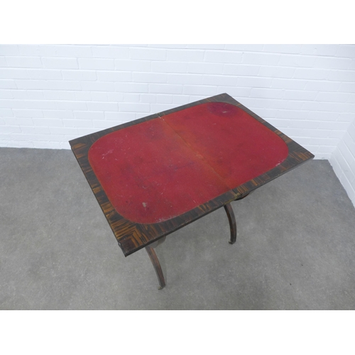 244 - 19th century coromandel / zebra wood card table, the fold over top with red baize interior over a si... 