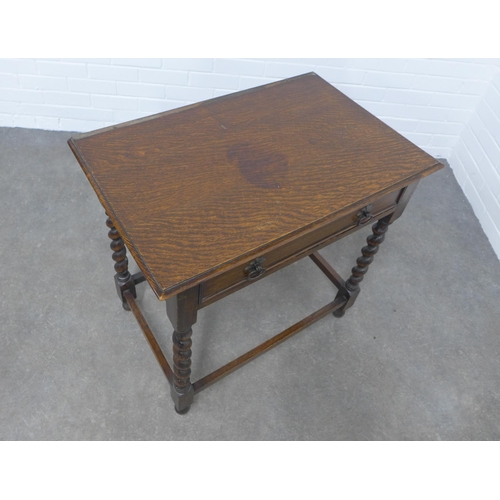 265 - An oak table, the rectangular top above a frieze drawer with barley twist supports, 76 x 72 x 49cm.