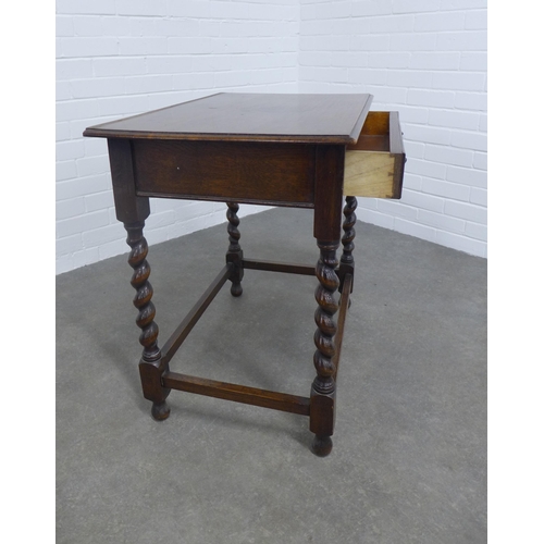 265 - An oak table, the rectangular top above a frieze drawer with barley twist supports, 76 x 72 x 49cm.