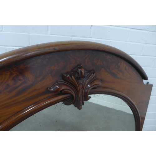 273 - Late 19th century mahogany overmantle mirror, arched top with leaf carved centre, 126 x 77cm.