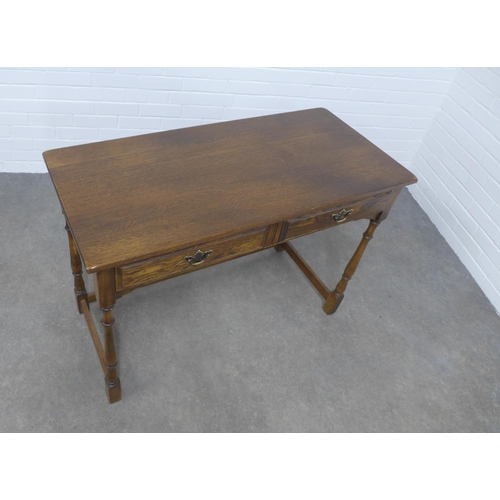 278 - An elm and oak  table, the rectangular top above two short frieze drawers, 109 x 76 x 51cm.