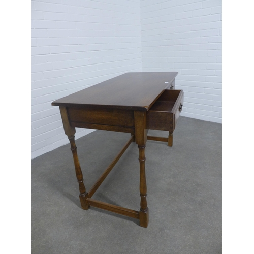 278 - An elm and oak  table, the rectangular top above two short frieze drawers, 109 x 76 x 51cm.