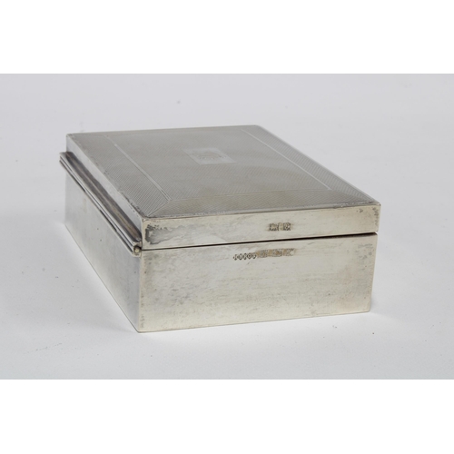 28 - A silver cigarette box, the hinged lid with engine turned decoration, Birmingham 1954, 11 x 8cm