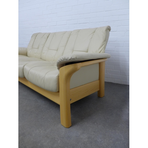 300 - Cream leather and beechwood three seater settee, 202 x 85 x 56cm.