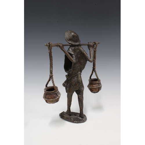 315 - Nigerian bronze figure of a Water Carrier, 31cm high