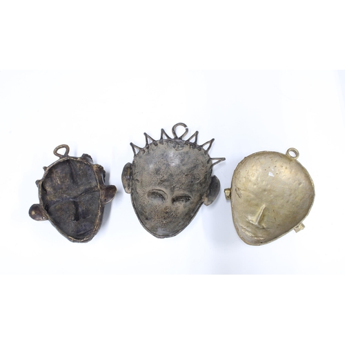 330 - Three West African bronze wall masks, longest 23cm (3)