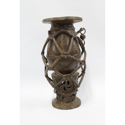 336 - West African bronze vase of baluster form within an entwined  ropework frame, 41cm high