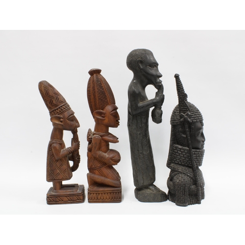 338 - King Oba, a Nigerian carved wood figure together with three other West African carved wood figures, ... 