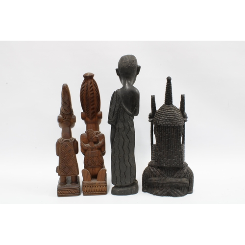 338 - King Oba, a Nigerian carved wood figure together with three other West African carved wood figures, ... 