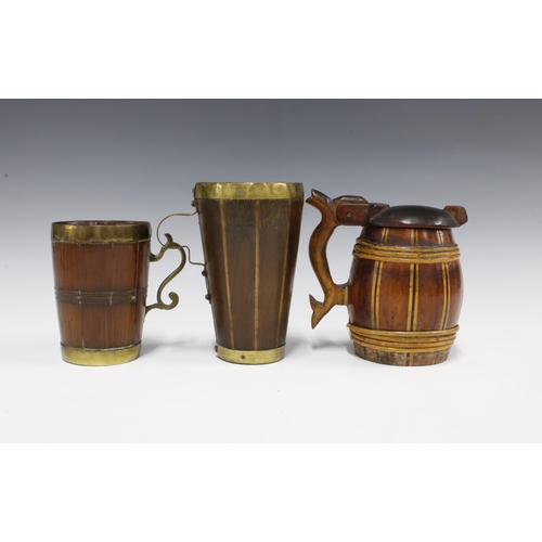 357 - Treen / woodenware to include two coopered brass bound tankards and a Scandinavian tankard (3)